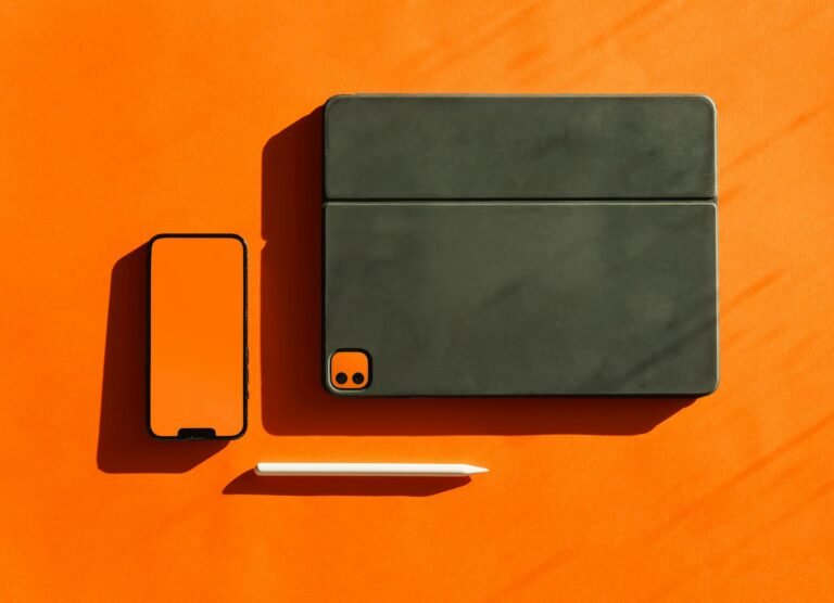 Electronic smart devices mockup. Orange background.